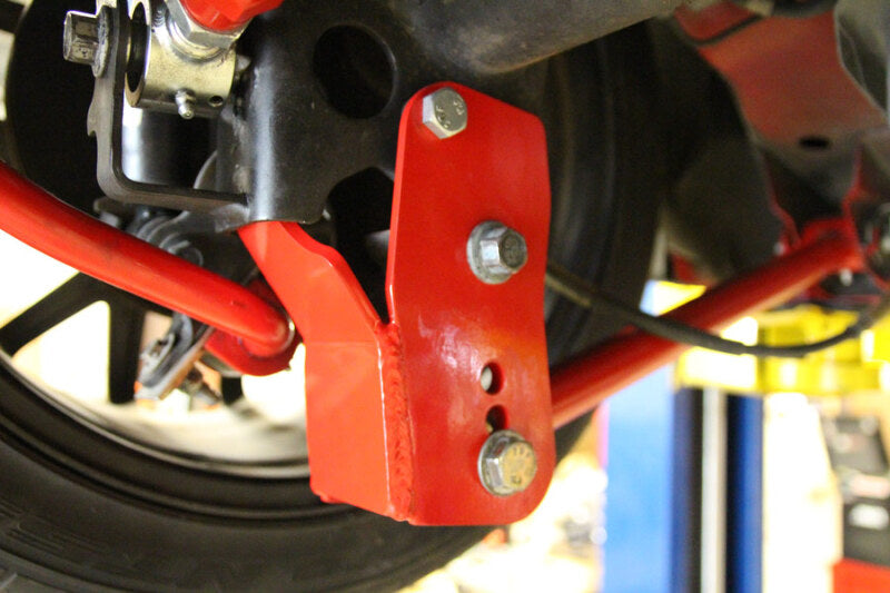 UMI Performance 1060-R Rear Control Arm Relocation Brackets Bolt-In Red