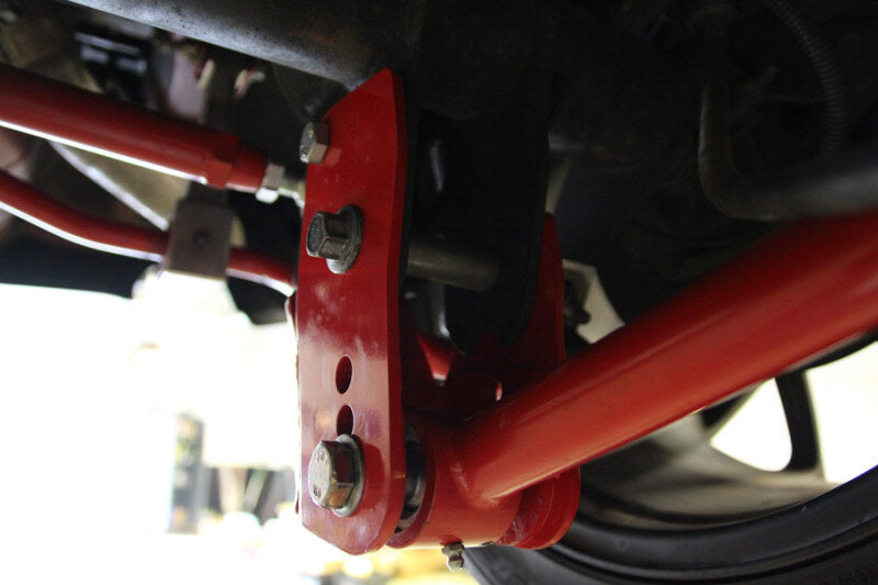 UMI Performance 1060-R Rear Control Arm Relocation Brackets Bolt-In Red